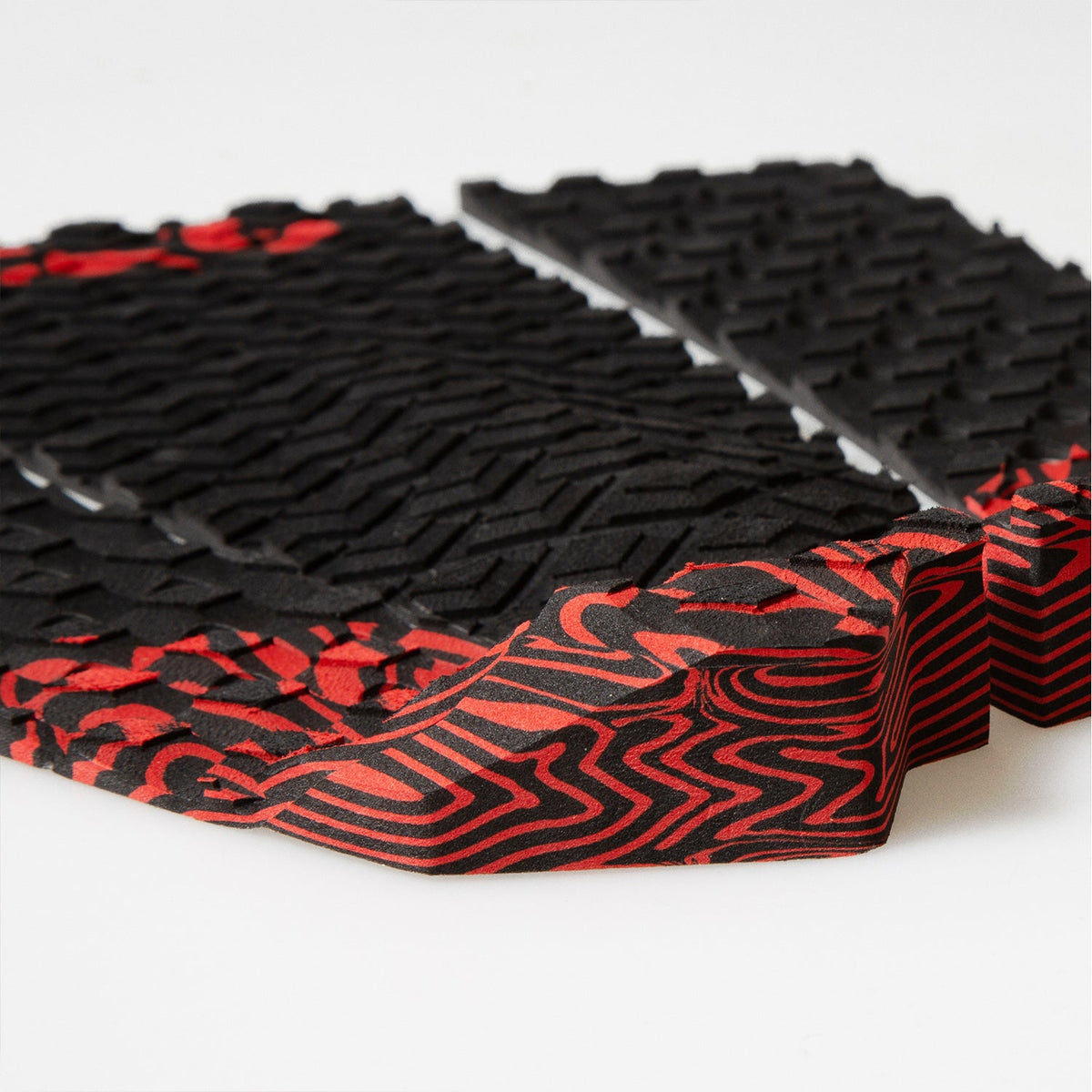 FCS Filipe Toledo Traction: low angle view of the red and black tail kick behind the textured foam