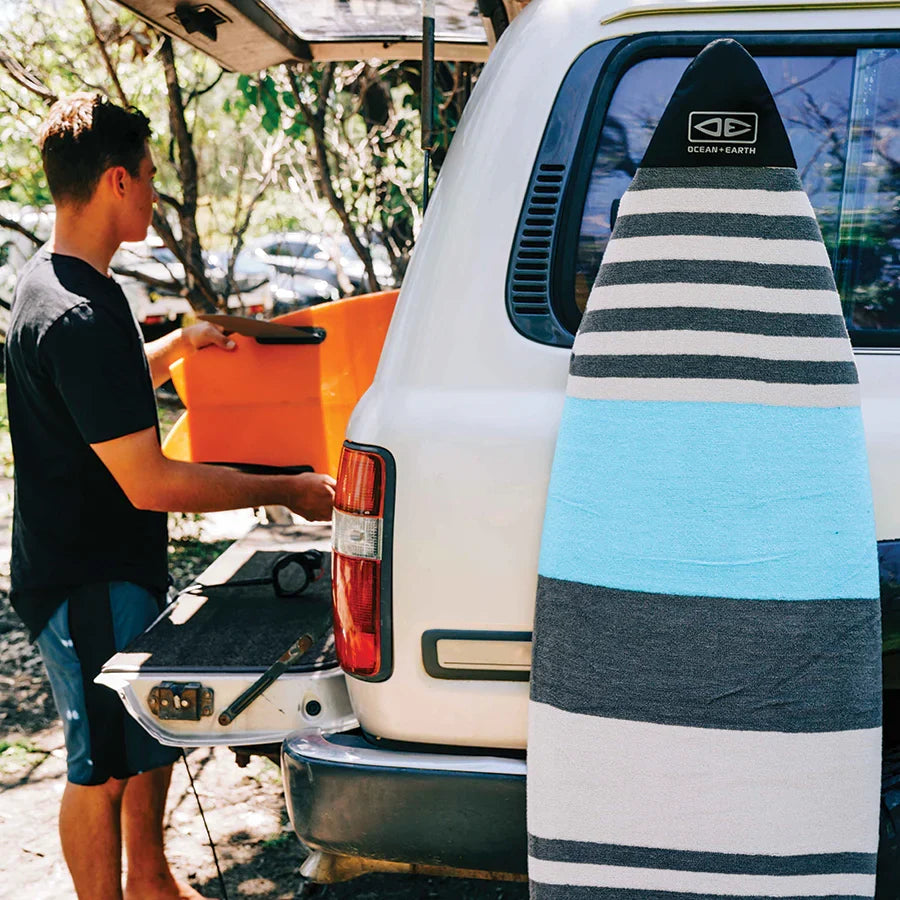 Ocean & Earth Stretch Fish Sock: sock on a surfboard beside a car