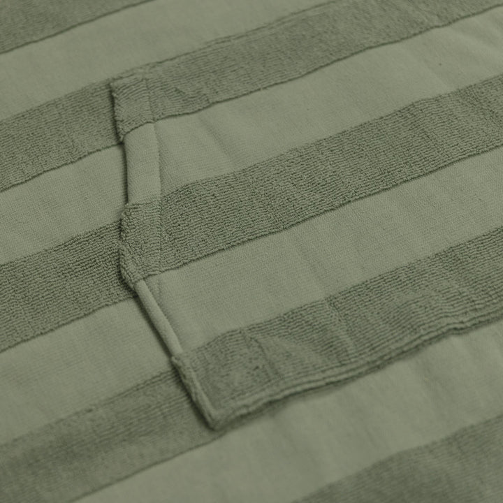 Ocean & Earth Ladies Layz Hooded Poncho: woven jacquard fabric and pocket close-up