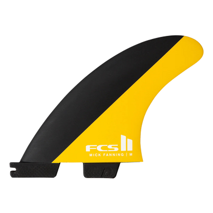 FCS II Mick Fanning Tri Fins - Performance Core: black and Mango fin with white FCS logo on the yellow panel