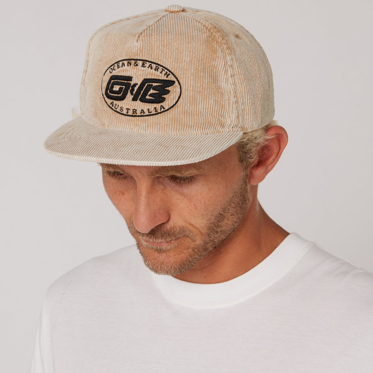 Ocean & Earth Heritage Cap: Almond cap worn, front angle