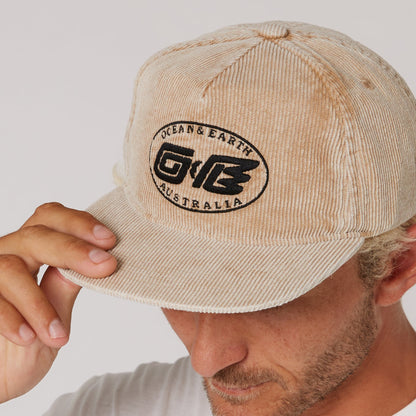 Ocean & Earth Heritage Cap: Almond cap brim and logo close-up