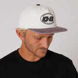 Ocean & Earth Heritage Cap: Antique White cap worn, side view