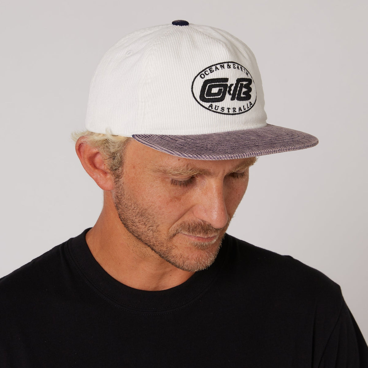 Ocean & Earth Heritage Cap: Antique White cap worn, side view