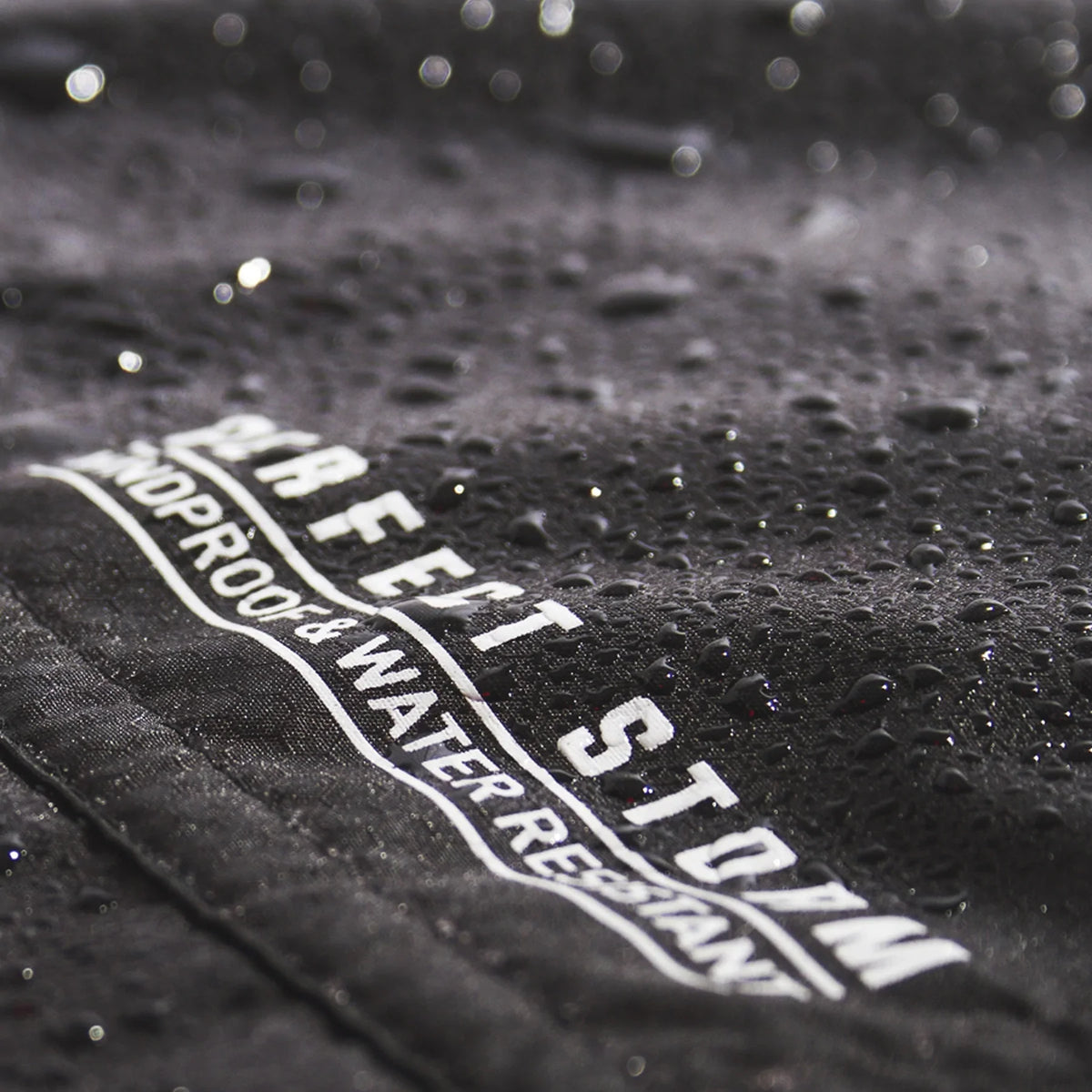 Ocean & Earth Perfect Storm Water-Resistant Poncho: water droplets on the outer fabric