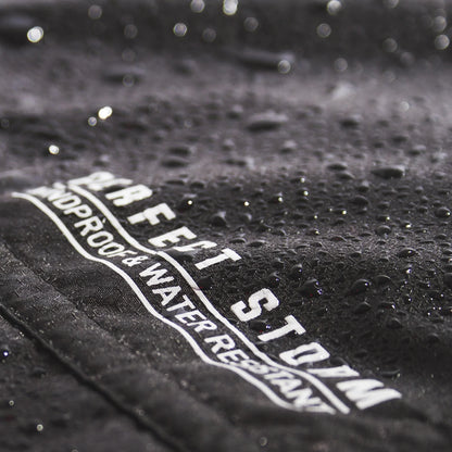 Ocean & Earth Perfect Storm Water-Resistant Poncho: water droplets on the outer fabric