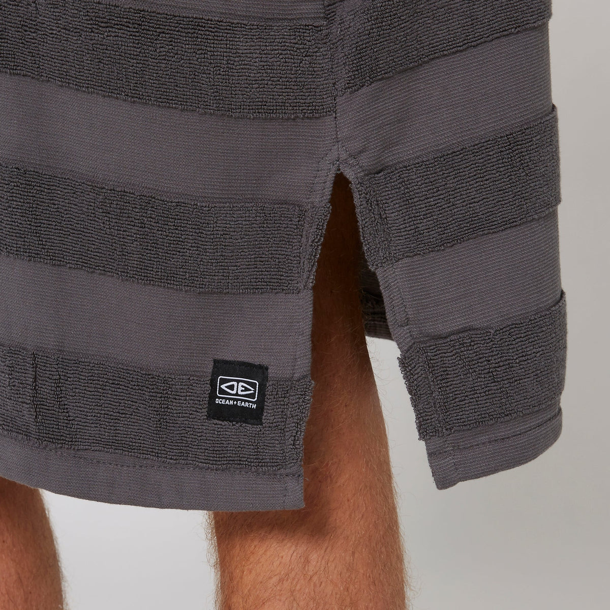 Ocean & Earth Mens Layz Hooded Poncho: Charcoal woven stripe and lower hem detail