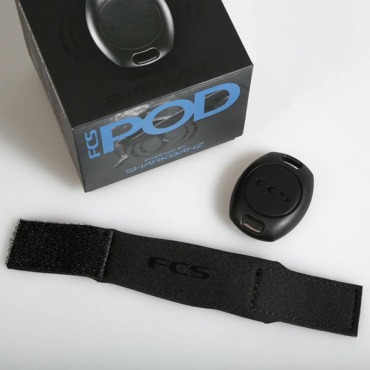 Black pouch opened beside the POD and its box