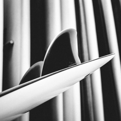 FCS II Christenson Keel - Performance Glass: black and White view of twin keels installed on a surfboard