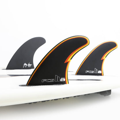 FCS II Gerry Lopez Tri Fins - Performance Core: three Gerry Lopez fins mounted on a white board