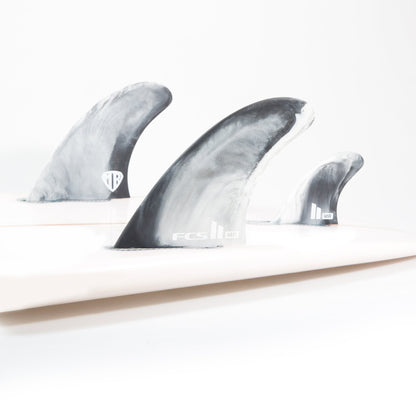 Mark Richards twin fins and centre stabiliser fitted to a white surfboard in the studio
