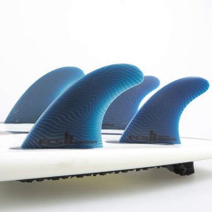 FCS II Performer Quad Fins - Eco Neo Glass: four Pacific fins mounted together on a white board