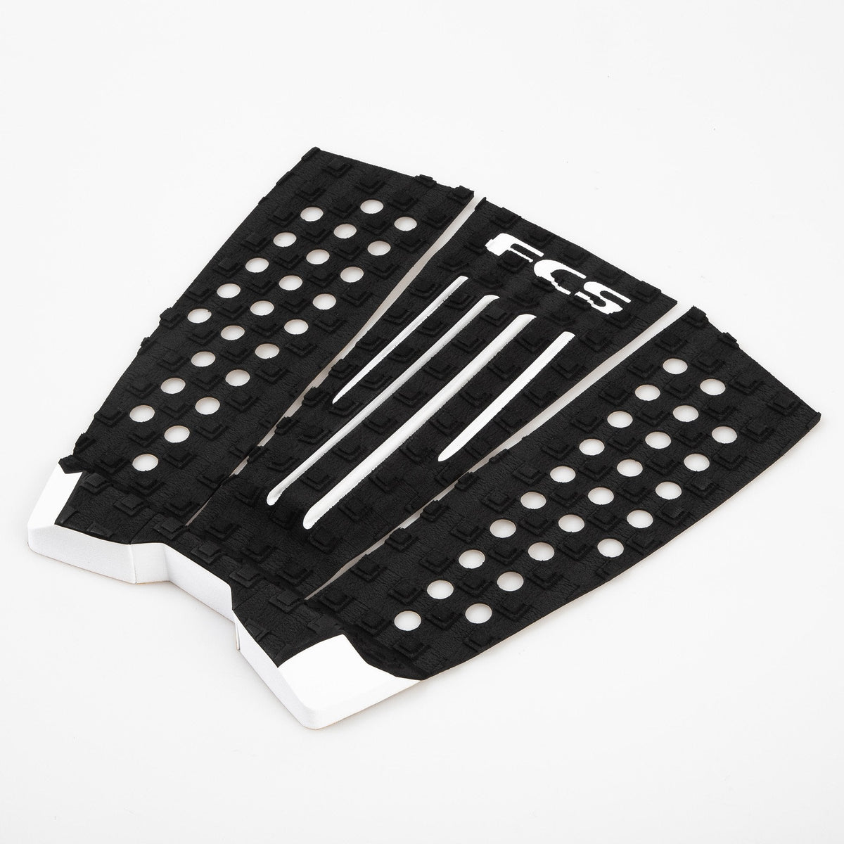 FCS Julian Wilson Traction: angled view of all three black and white pad sections