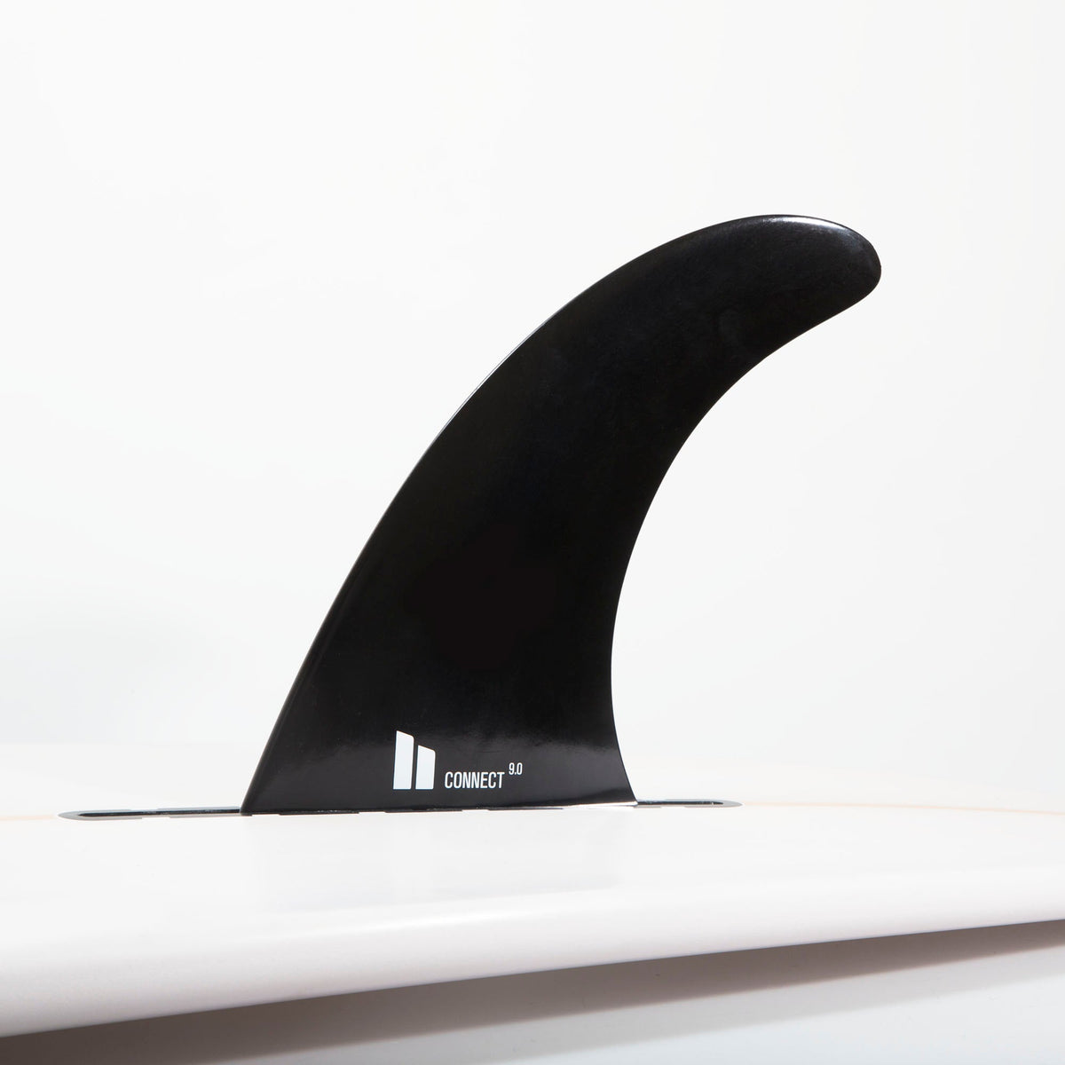 FCS II Connect Longboard Fin - Soft Flex: soft Flex Connect fin installed in a white board