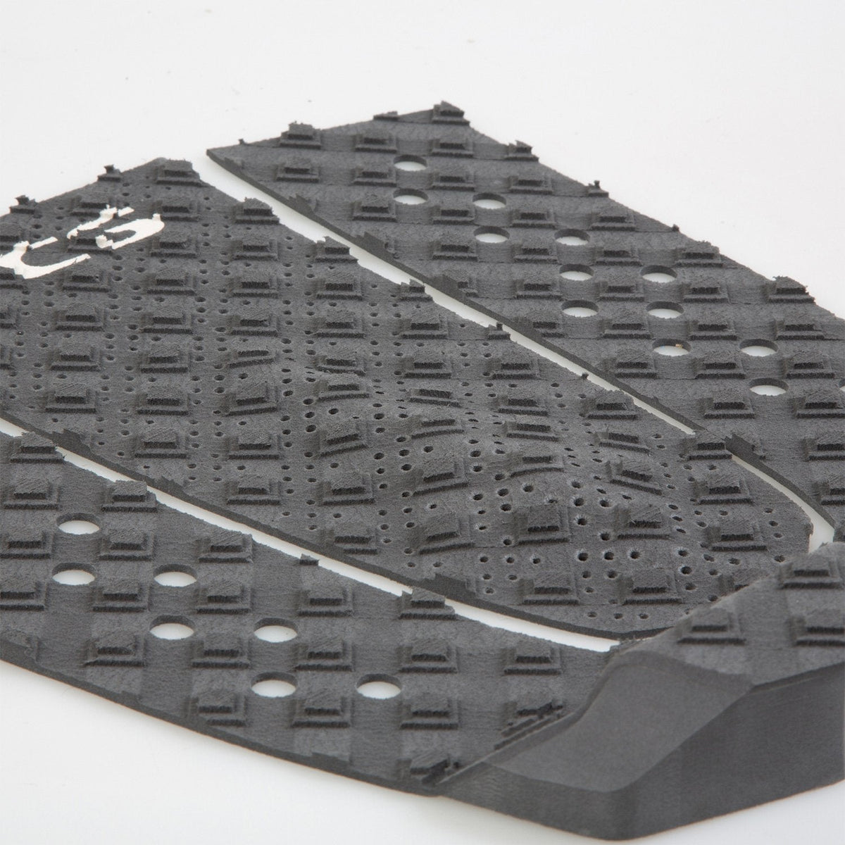 Close detail of raised grip blocks and perforations on the T-3 pad