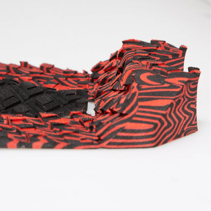 FCS Filipe Toledo Traction: side profile of the red and black patterned high tail kick