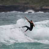 FCS II Al Merrick Twin + Stabiliser Fins - Performance Core: surfer carving a small coastal wave