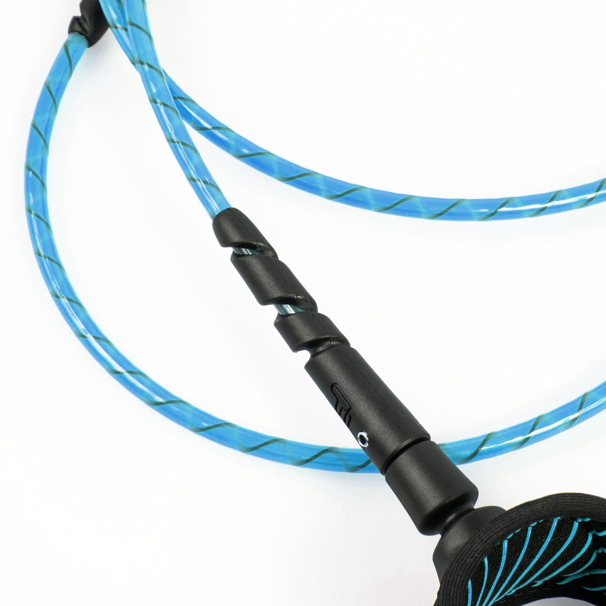 FCS Freedom Helix Leash - Longboard: blue cord, cuff edge and reinforced connection in close view