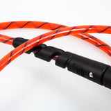 FCS Freedom Helix Leash - All Round: close view of the red cord and black moulded connection
