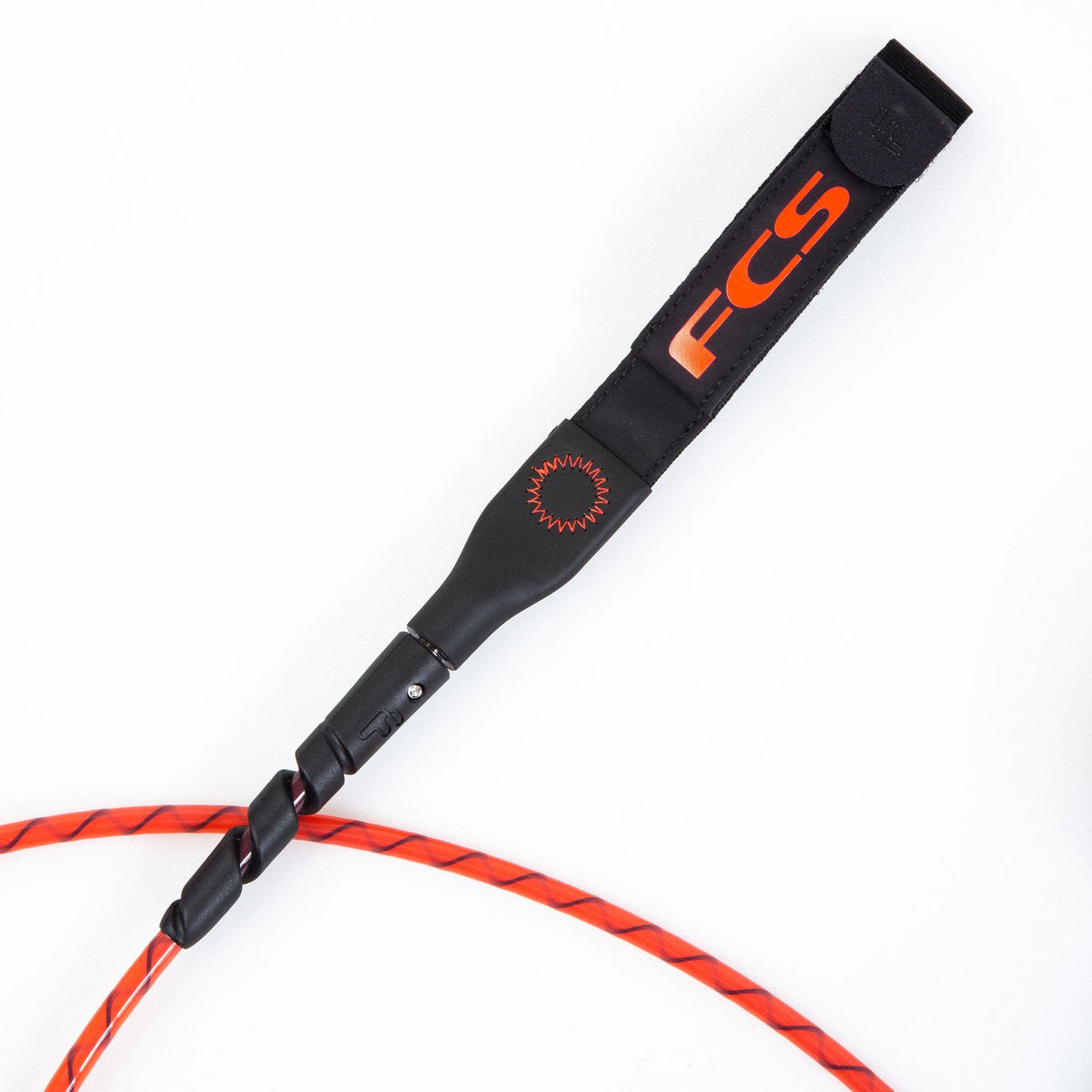 FCS Freedom Helix Leash - All Round: slim black railsaver with orange FCS lettering