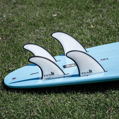 FCS II Harley Mid Tri-Quad Fin Set - Performance Core + AirCore: five Harley Mid fins installed on boards on grass