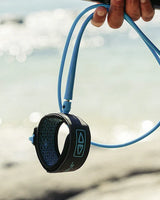 Ocean & Earth Premium One-XT Leash – 6 ft: Blue leash carried on a beach
