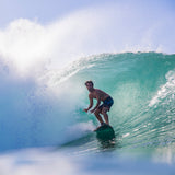 FCS II Mason Ho Tri Fins - PC + AirCore: mason Ho riding inside a breaking blue wave