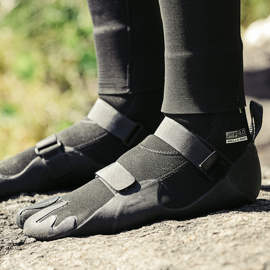 Ocean & Earth Bells 3 mm Split-Toe Booties: booties worn on a rocky shoreline