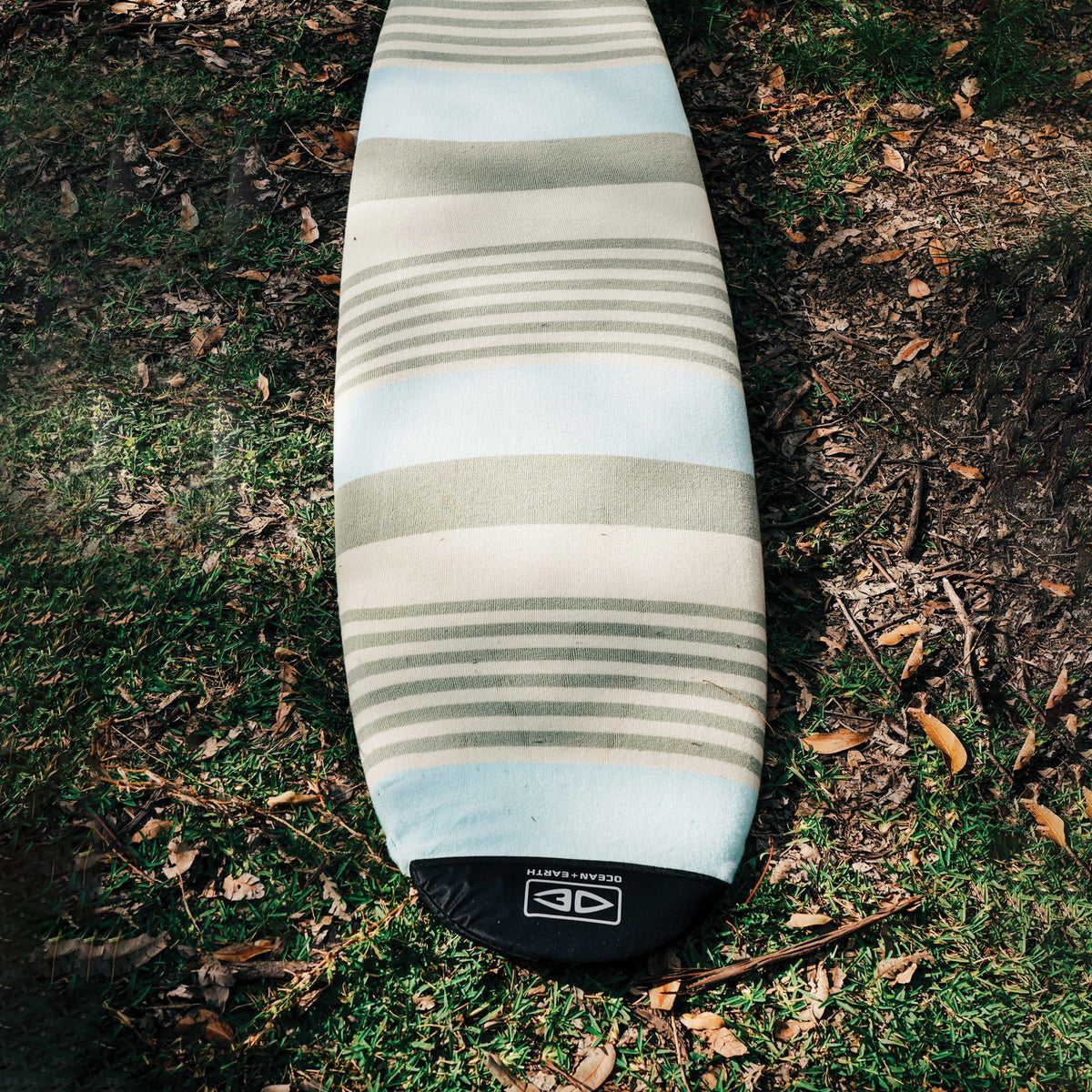Ocean & Earth Stretch Longboard Sock: longboard sock resting outdoors