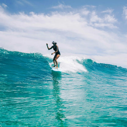 Ocean & Earth Indo Stiff Peak Surf Hat: Surf hat worn during a wave ride