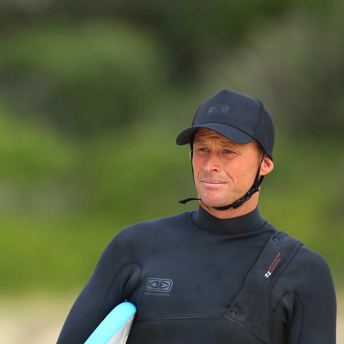 Ocean & Earth Deserts Mesh Trucker Surf Cap: Surf cap worn beside the water