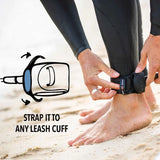 Hands attaching a POD pouch to an ankle leash cuff