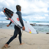 Ocean & Earth Kanoa Igarashi Signature Traction Pad: surfer carrying a board with the pad fitted