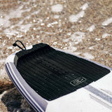 Ocean & Earth Flight Three-Piece Traction Pad: pad fitted on a board at the beach