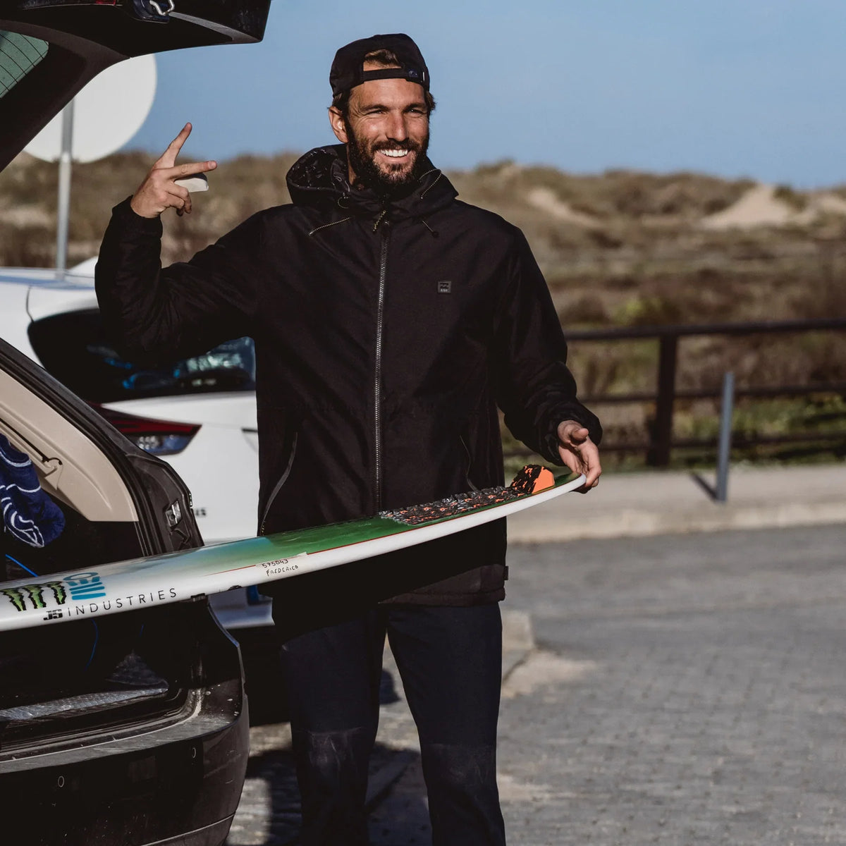 Ocean & Earth Frederico Morais Pro Tail Pad: Frederico Morais beside a surfboard