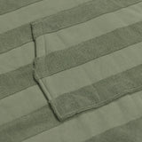 Ocean & Earth Ladies Layz Hooded Poncho: woven jacquard fabric and pocket close-up
