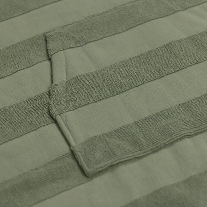 Ocean & Earth Ladies Layz Hooded Poncho: woven jacquard fabric and pocket close-up