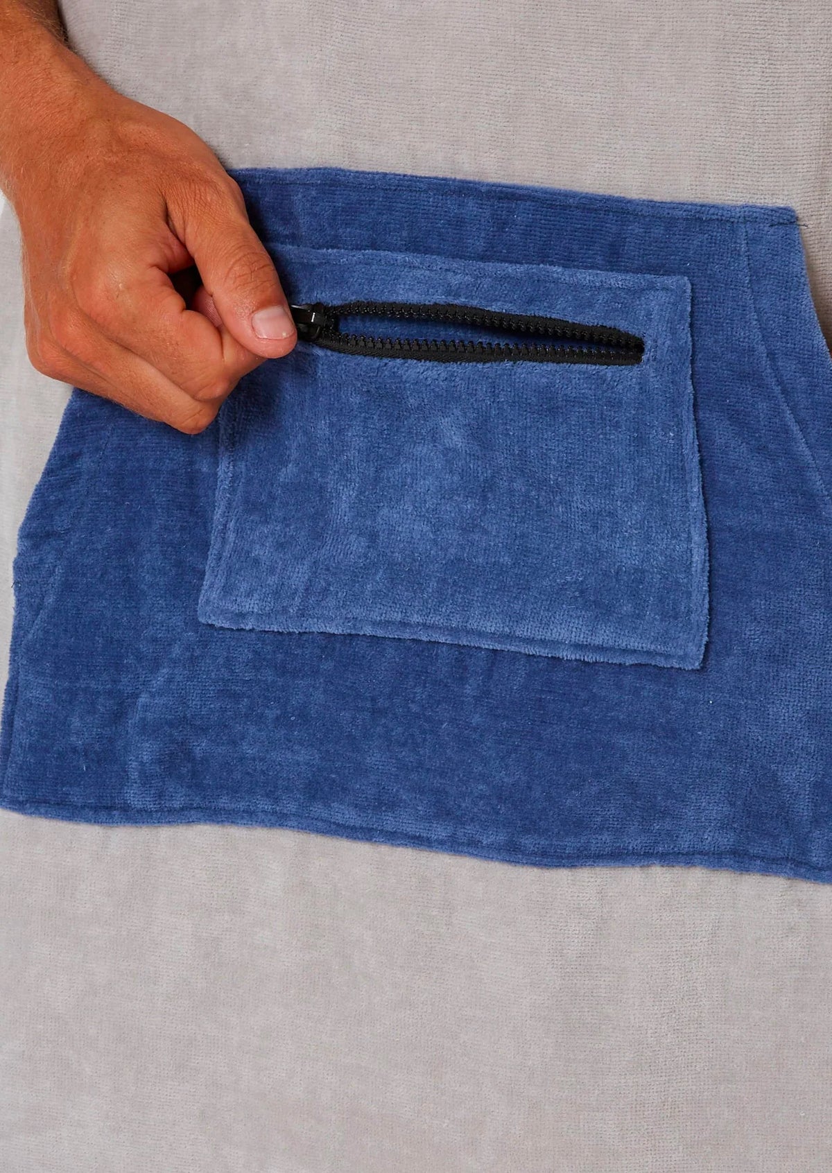 Ocean & Earth Day Break Hooded Poncho: Light Grey poncho zipped Blue pocket close-up