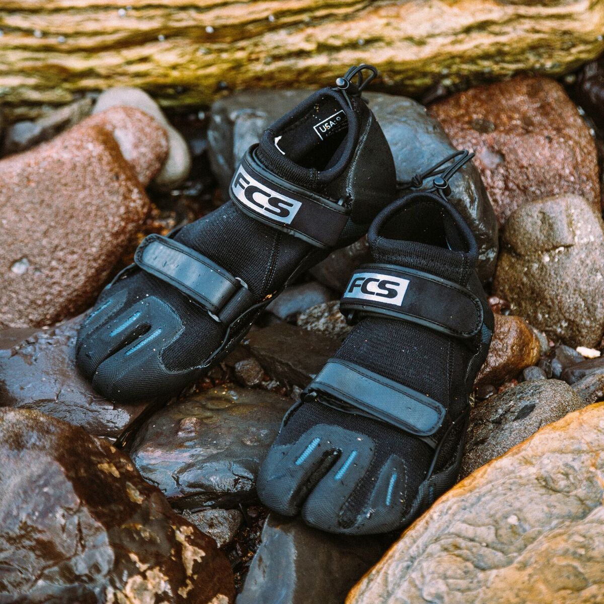 FCS SP2 Reef Boots: reef boots resting on coastal rocks